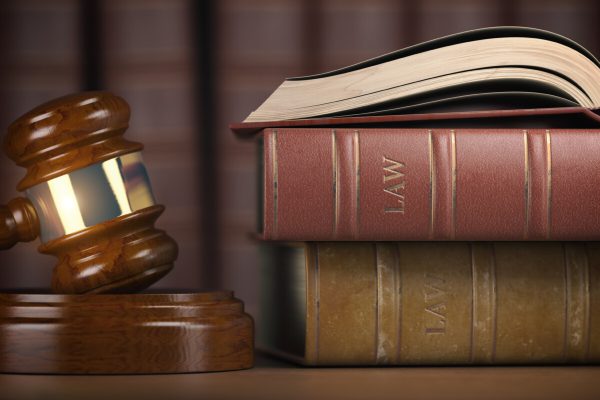 Justice, law and legal concept. Judge gavel and law books. 3d illustration